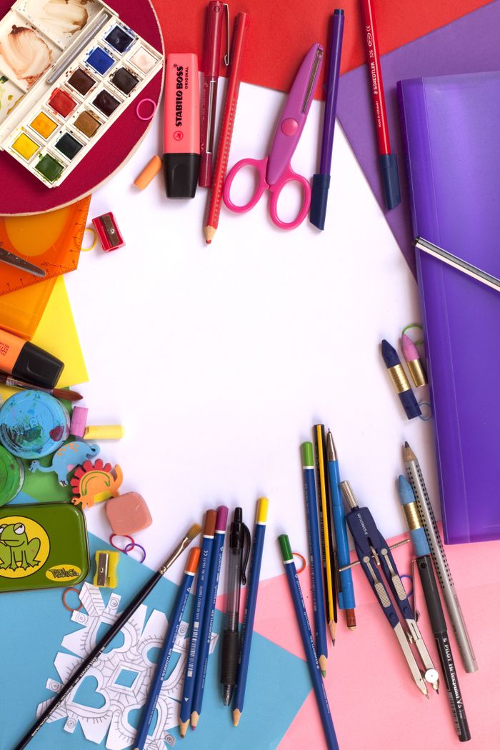 about-01 Vibrant collection of art and school supplies arranged in a flat lay. Perfect for educational themes.
